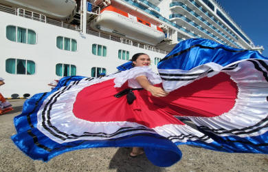 Traditional Costa Rican dance performance with colorful costumes and live folk music on stage - Macaws Tours by Pablo C