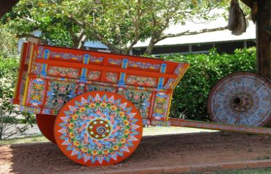 Traditional oxcart painting and artisan craftsmanship at Costa Rican factory with colorful designs - Macaws Tours by Pablo C